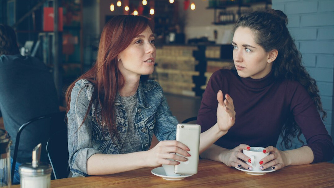 two people in deep conversation