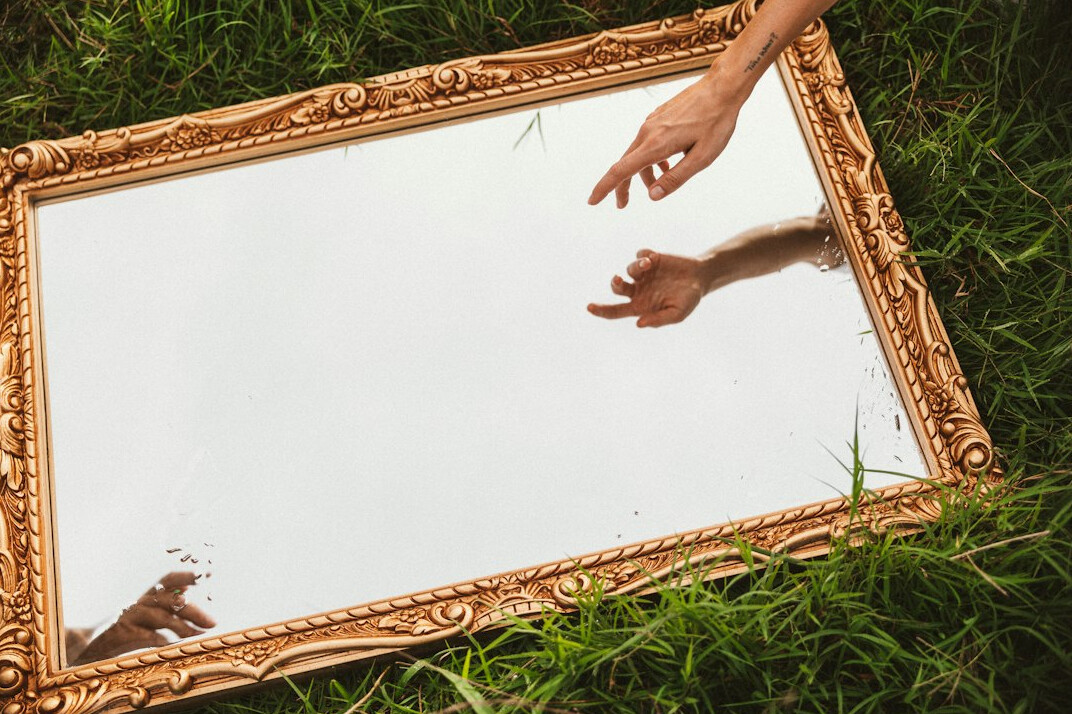 person practicing speech in mirror