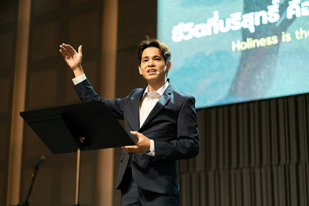 confident speaker at podium